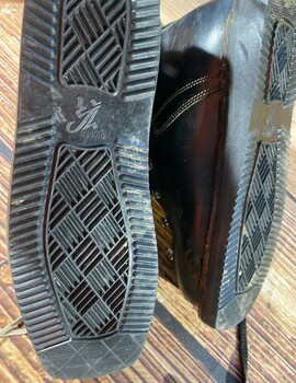 Boot soles showing tread and logo