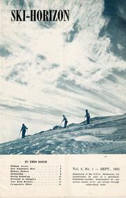 Three skiers on a slope beneath cloudy skies.