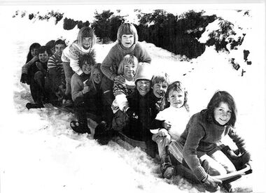 A group of Falls Creek Children on toboggan