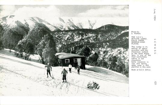 Four skiers outside Skyline Lodge