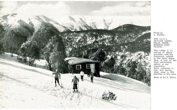 Four skiers outside Skyline Lodge