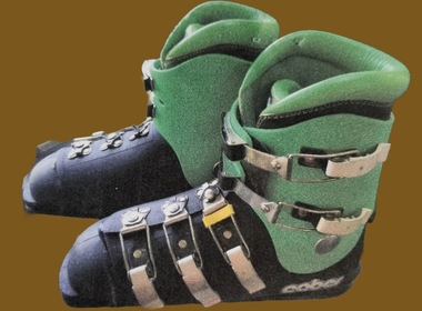 Lime green and black Caber Ski Boots