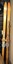 A set of wooden skis with bindings and poles