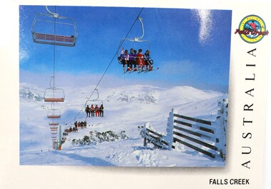 Skiers on the Scott Quad Chair rising over the Bogong High Plains