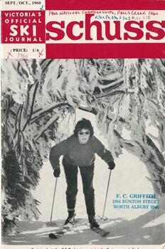 Cover  Female Skier passing beneath trees