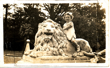 Photograph - Digital image, Kaye Moorhouse aged 4 on lion statue in the Gardens, 1950