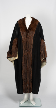 7/8 length black ceremonial robe with fur collar and cuffs and cream lining.