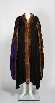 Black ceremonial mayoral robe with fur collar and sleeve edging, purple sleeve lining.
