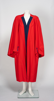 Red academic robe with blue front trim.