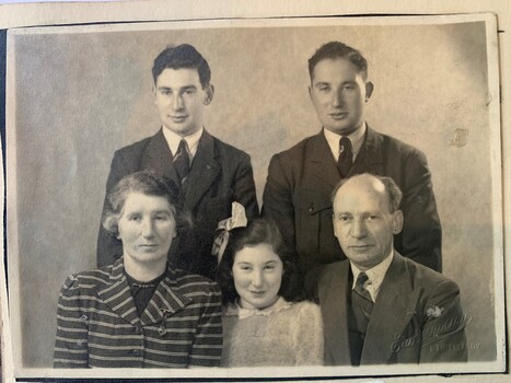 A black and white family portrait 
