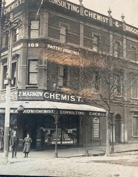 Image of a chemist shop on a corner in the 1920s