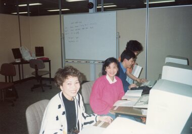 Photograph - KNH 5/7/012 Three students at desktop computers. Labelled "Computer Vietnamese '91"
