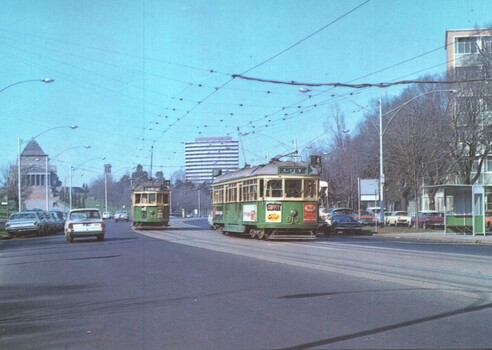 St Kilda Road, with W class trams and the Shrine of Remembrance