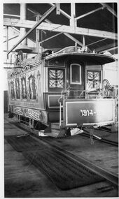 Black and white photograph of a decorated cable tram set, celebrating the peace after World War 1, soon after the signing of the Treaty of Versailles.