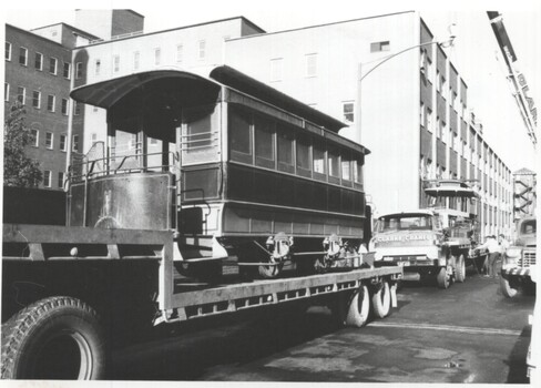 Photograph - both vehicles loaded onto semi trailers - Lonsdale St at corner with Russell St.