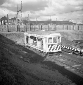 Tram 15 - sleeper transport car with flat car trailer 20 alongside.
