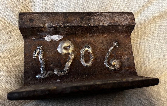 Section of 1906 rail - Essendon Tram Depot - with date welded onto side.