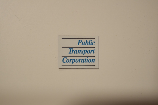 White rectangular sheet magnet with the text "Public Transport Corporation" printed on one side.