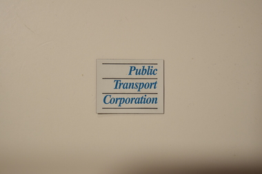 White rectangular sheet magnet with the text "Public Transport Corporation" printed on one side.