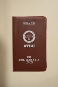 A leather-textured diary advertising the Rail Tram & Bus Union (RTBU).