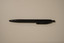 Black retractable pen with white text printed on the side advertising the RTBU.