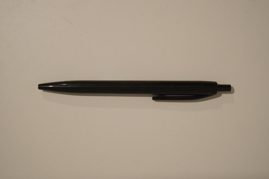 Black retractable pen with white text printed on the side advertising the RTBU.