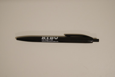 Black retractable pen with white text printed on the side advertising the RTBU.