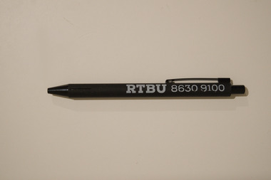 Black retractable pen with white text printed on the side advertising the RTBU.