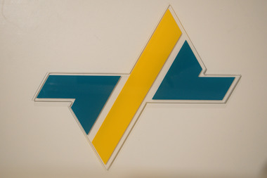 Plastic/acrylic PTC logo with additional letters "P," "T" and "C." All have Velcro patches on reverse side.
