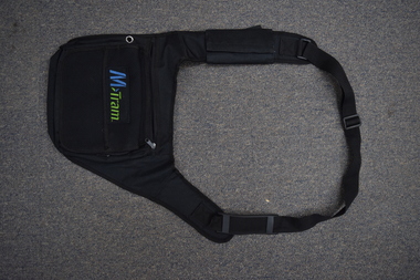 The outward-facing side of a black M>Tram CSE bag.
