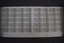 A sheet of laminated paper with multiple copies of PTC scratch tickets printed.