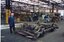 he 21E truck from the tram at the Preston Workshops with Lloyd Rogers standing alongside.