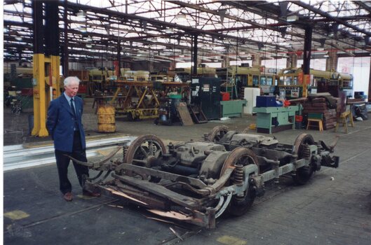 he 21E truck from the tram at the Preston Workshops with Lloyd Rogers standing alongside.