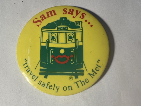 badge - "Sam says..."travel safely on The Met'"
