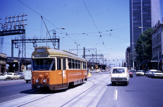 Flinders St -route 74  near William St with the railway viaduct in the background