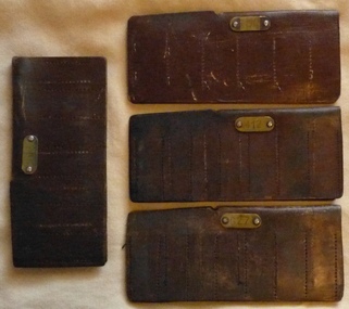 Set of four leather MMTB/The Met ticket wallets,