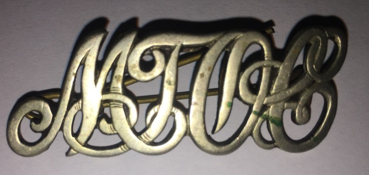 MTOCo lapel badge front