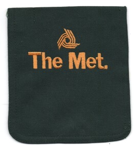Uniform patch or item from a green The Met jacket