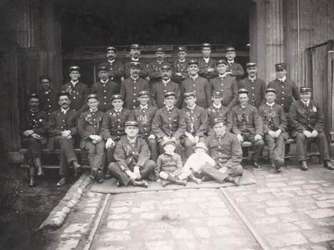 28 MTCo employees in a group photo at Clifton Hill cable tram depot