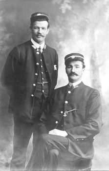 two tramway cable tram employees, in full uniform