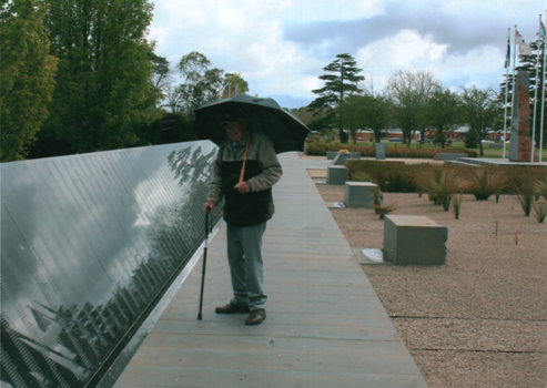 Norm Maddock visiting the Australian Ex-Prisoners of War Memorial