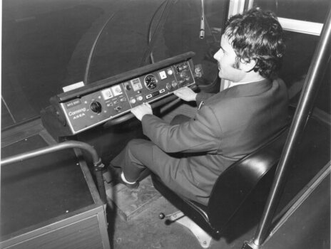 Control stand with a man in the driver's seat.