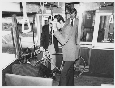 Demonstration of stowing bicycle into W class tram