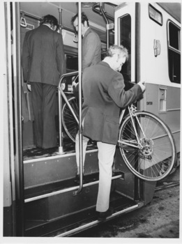 Demonstration of stowing bicycle being carried onto a Z class tram