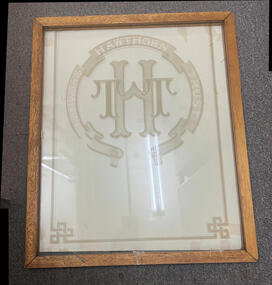 Framed HTT logo with a card sheet behind.