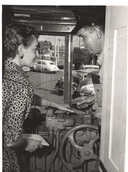Showing a reporter how to drive a tram - photo