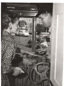 Showing a reporter how to drive a tram - photo