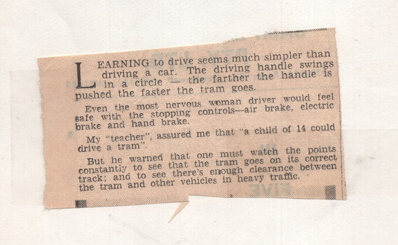 Showing a reporter how to drive a tram - cutting