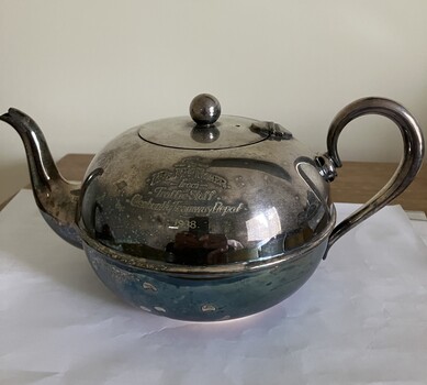 Engraved silver tea pot