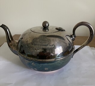 Engraved silver tea pot